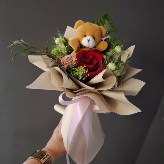 Teddy bear with red rose