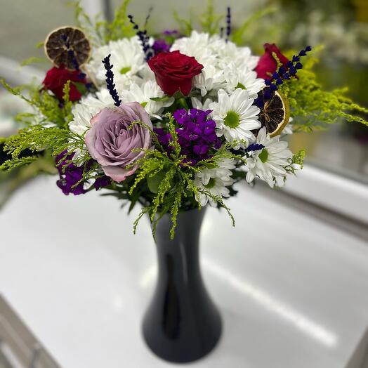 Daisies and Roses in The Black Vase