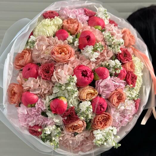 Stylish bouquet of peonies and peony-shaped roses