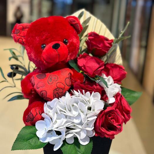 Small teddy with roses