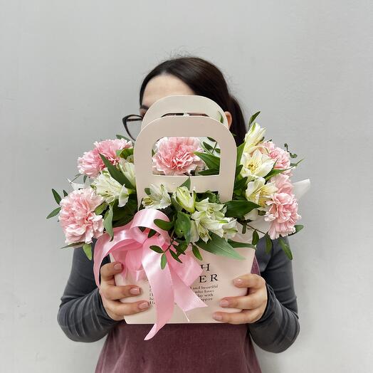 A delicate composition of white alstroemeria and dianthus