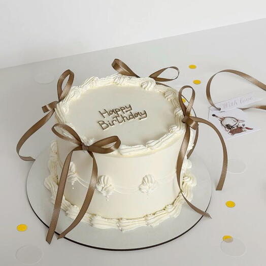 Vintage off white cake with Brown Bow Birthday cake