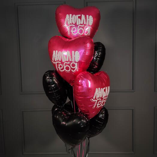 Composition of black hearts and with the inscription I love you