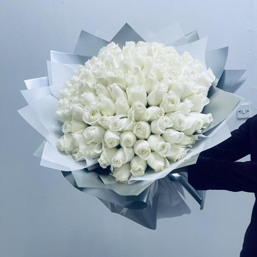 White 101 roses with silver wrrping paper