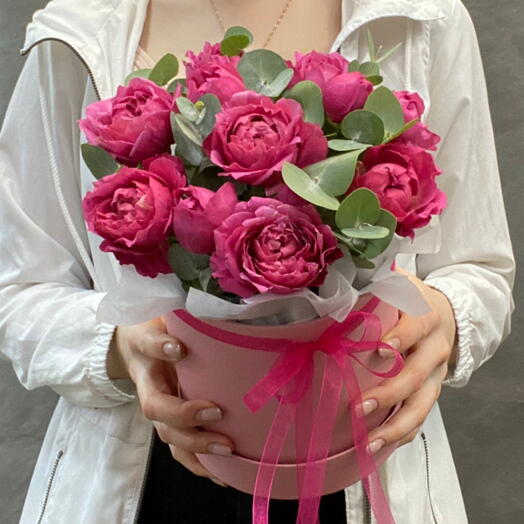 A peony-shaped Juliet rose in a box