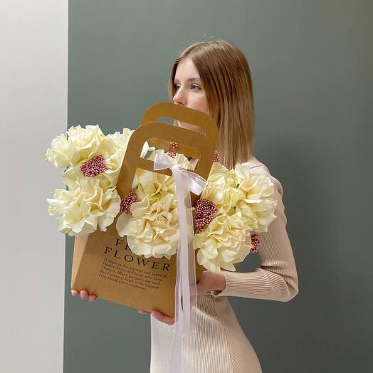 French roses with ozothamnus in a craft handbag