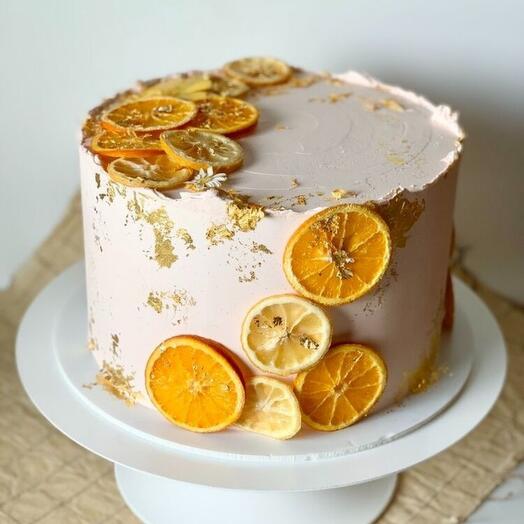 Orangecake with orange lemon as decoration