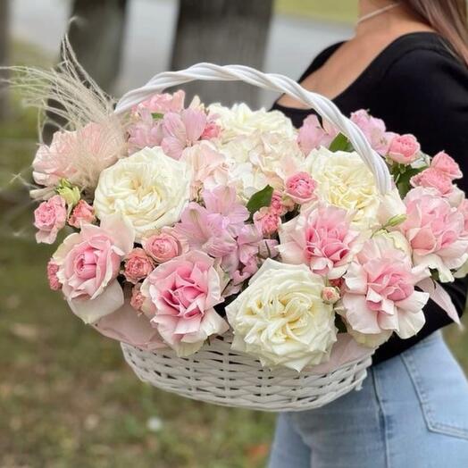 Basket with flowers of roses, hydrangeas and alstroemeria