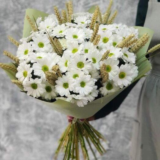 Bouquet of chamomile chrysanthemum and dried wheat ears