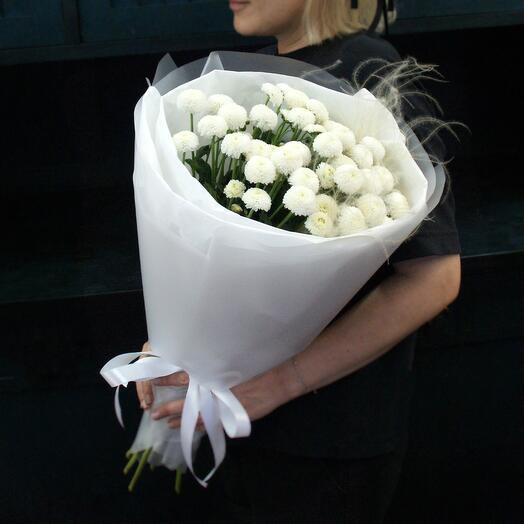 Delicate bouquet of bush chrysanthemum newton with an airy feather bed in a designer package