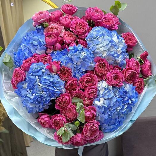 Bouquet of blue hydrangeas and bush peony roses