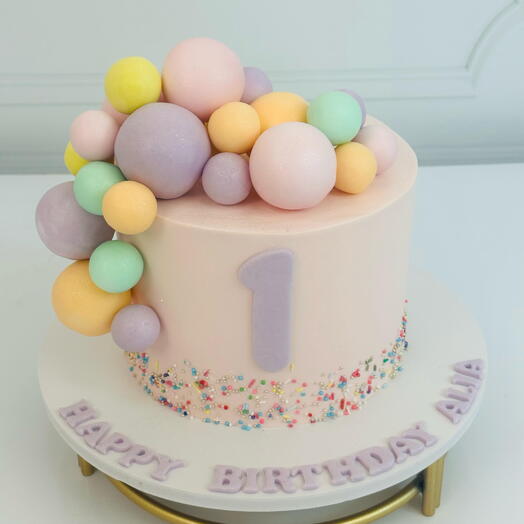 Elegant Light Pastel Pink Birthday Cake with Soft Pastel Balloons – A Dreamy Celebration