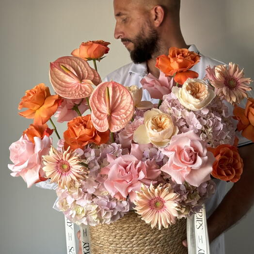 Basket with anthurium, hydrengeas, roses and gerberas