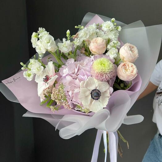 Delicate and lush bouquet with anemones and hydrangea